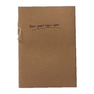 a brown booklet with "your quest begins here" written on the cover